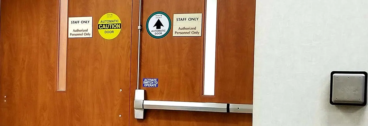 Hospital door with a panic bar and access reader