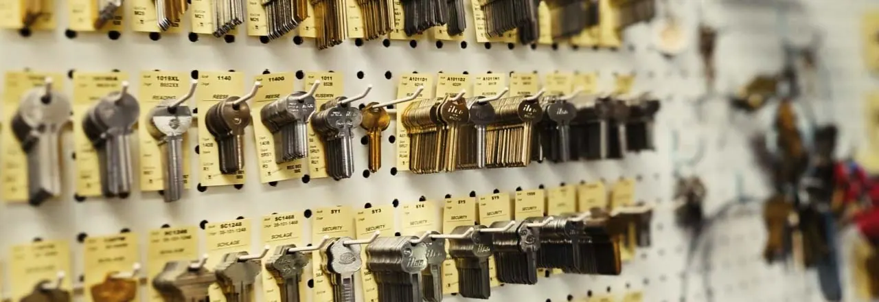 Wall of key blanks sorted on pegboard hooks