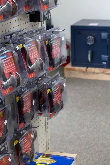 Padlocks on the rack with a safe behind